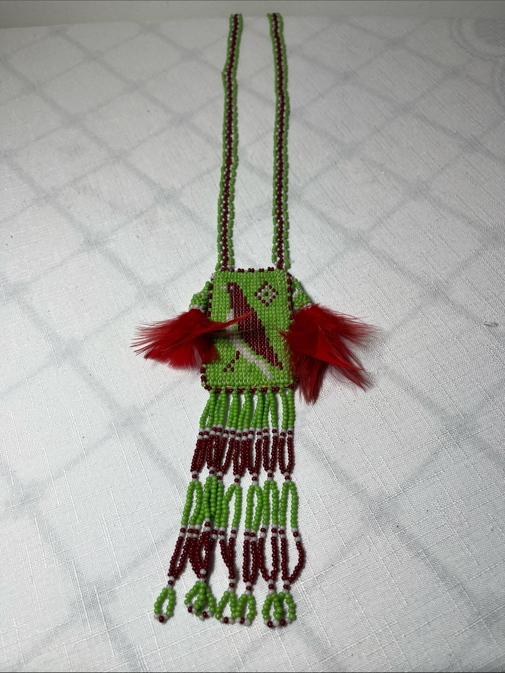 Vintage Native American-style seed bead necklace
central square pouch
Bird motif